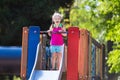Child playing on outdoor playground in summer Royalty Free Stock Photo