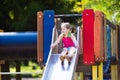 Child playing on outdoor playground in summer Royalty Free Stock Photo