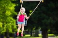 Child playing on outdoor playground in summer Royalty Free Stock Photo