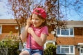 Child playing on outdoor playground and swing. Kids play on school or kindergarten yard. Active kid on colorful swing Royalty Free Stock Photo