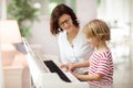 Child playing piano. Kids play music Royalty Free Stock Photo