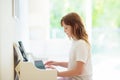 Child playing piano. Kids play music Royalty Free Stock Photo