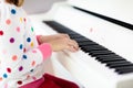 Child playing piano. Kids play music Royalty Free Stock Photo