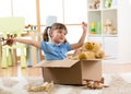 Child playing with plane toy at home. Travel, freedom and imagination concept. Royalty Free Stock Photo