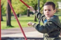 Child playing in playinground in park Royalty Free Stock Photo