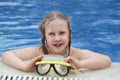 Child playing in pool. Little girl having fun in the pool. Summer holidays and vacation concept Royalty Free Stock Photo