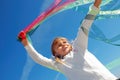 Child playing with ribbons