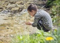 Child by playing in river water Royalty Free Stock Photo