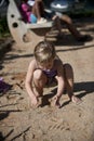 Child playing with sand on the playground Royalty Free Stock Photo