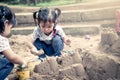 Child playing with sand in playground Royalty Free Stock Photo