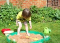 Child playing in a sandpit.