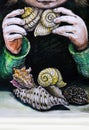 Child Playing with Seashells