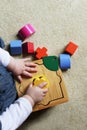 Child playing with shape sorter