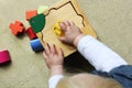 Child playing with shape sorter