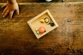 Child playing with small toy planets on an old wooden table Royalty Free Stock Photo