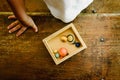 Child playing with small toy planets on an old wooden table Royalty Free Stock Photo