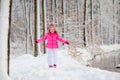 Child playing with snow in winter. Kids outdoors Royalty Free Stock Photo