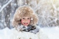 Child playing with snow in winter. Kids outdoors Royalty Free Stock Photo