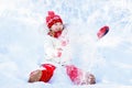 Child playing with snow in winter. Kids outdoors. Royalty Free Stock Photo