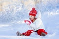 Child playing with snow in winter. Kids outdoors. Royalty Free Stock Photo