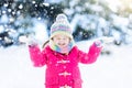 Child playing with snow in winter. Kids outdoors. Royalty Free Stock Photo