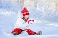 Child playing with snow in winter. Kids outdoors. Royalty Free Stock Photo