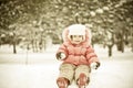 Child playing at snowballs