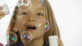 Child Playing Soap Bubbles, Happy Smiling Girl Blowing Balloons, Slow Motion Royalty Free Stock Photo