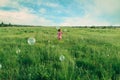 Child playing among soap bubbles in summer Royalty Free Stock Photo