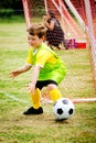 Child playing soccer goalie