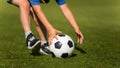 Child playing soccer. Preschool soccer leagues. Kid catching soccer ball on the field. Closeup soccer picture