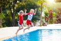 Child in swimming pool. Summer vacation with kids Royalty Free Stock Photo