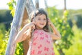 Child playing on swing. Healthy summer activity for children in warm weather. Little kids swinging. Cute little girl Royalty Free Stock Photo