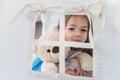 Child playing with a teepee tent