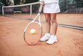 Child playing tennis on outdoor court