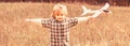 Child playing with toy airplane. Happy child playing. Happy child playing outdoors. Happy boy play airplane. Little boy