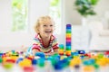 Child playing with toy blocks. Toys for kids Royalty Free Stock Photo