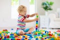 Child playing with toy blocks. Toys for kids Royalty Free Stock Photo
