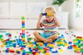 Child playing with toy blocks. Toys for kids Royalty Free Stock Photo