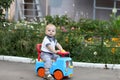 Child playing on toy car Royalty Free Stock Photo