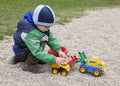 Child playing with toy digger Royalty Free Stock Photo