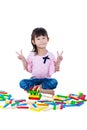 Child playing toy wood blocks, isolated on white background. Royalty Free Stock Photo