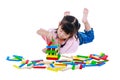 Child playing toy wood blocks, isolated on white background. Royalty Free Stock Photo