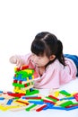 Child playing toy wood blocks, isolated on white background. Royalty Free Stock Photo