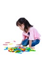 Child playing toy wood blocks, isolated on white background. Royalty Free Stock Photo