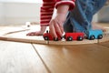 Child playing with toy wooden train Royalty Free Stock Photo