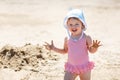 Child playing on tropical beach. Little girl digging sand at sea shore. Travel with young children Royalty Free Stock Photo