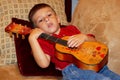 Child Playing a Ukulele Royalty Free Stock Photo