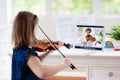 Child playing violin. Remote learning Royalty Free Stock Photo