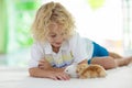 Child with rabbit. Easter bunny. Kids and pets. Royalty Free Stock Photo